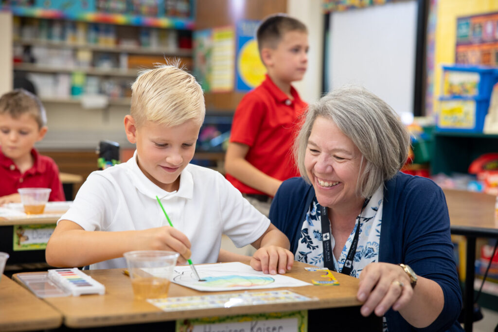 Principal Gina Ashley with a Catholic school student in the classroom