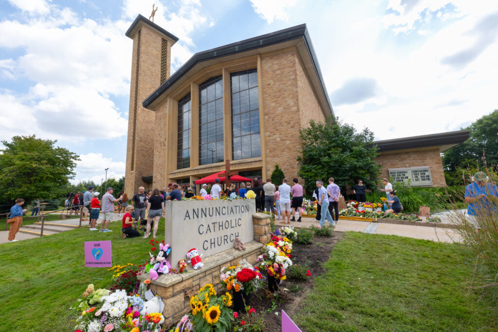 Flower memorial outside of Annunciation Catholic Church in Minneapolis